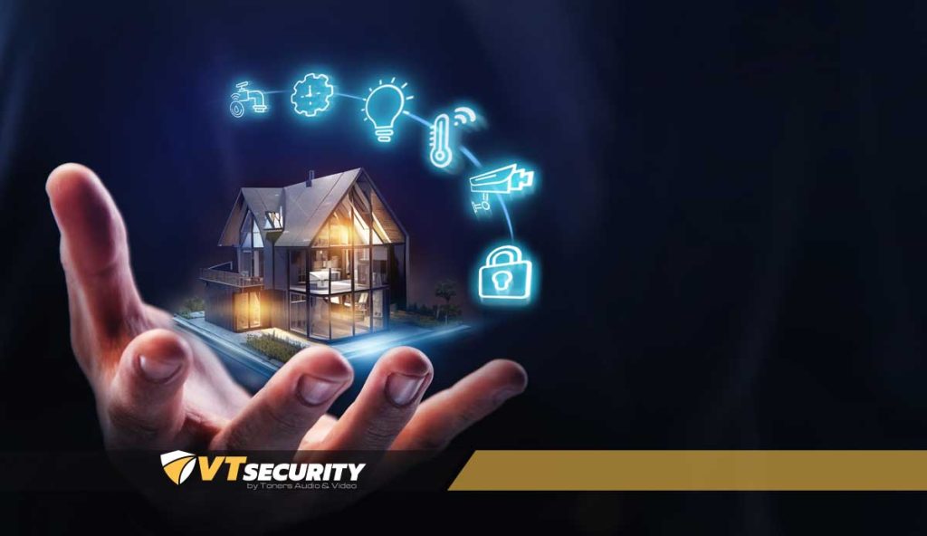 Smart home automation concepts with illuminated icons representing security, lighting, and climate control, overlaid on a hand holding a modern house, featuring VT Security branding.